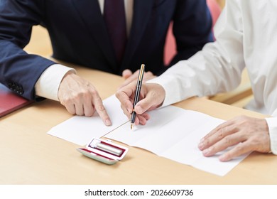 Hands of elderly people who consult with the profession about inheritance and wills - Shutterstock ID 2026609736