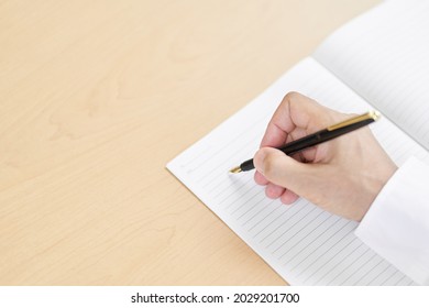 Hands Of Elderly People Writing Sentences With A Fountain Pen