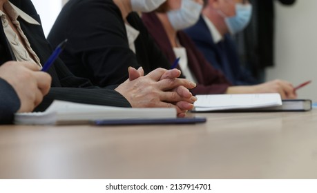 Hands Of An Elderly Woman Participating In A Meeting Or Negotiations During The Coronavirus Pandemic. Age Official, Lawyer Or Businesswoman. Business And The Coronavirus Pandemic. No Face. Close-up