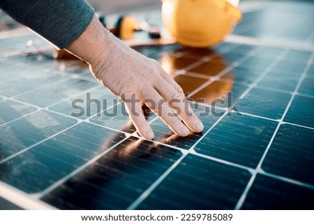 Hands, engineer and solar panel in construction for renewable energy, electricity or technology. Hand of electrician or technician feeling heated plates for quality, sun or testing power on building