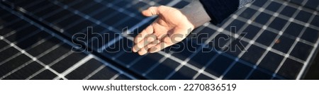 Hands, engineer and solar panel in construction for renewable energy, electricity or technology. Hand of electrician or technician feeling heated plates for quality, sun or testing power on