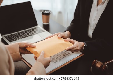 Hands exchanging a brown envelope stuffed with cash, depicting bribery and secret illegal transactions in a business or legal setting affecting governance and financial integrity