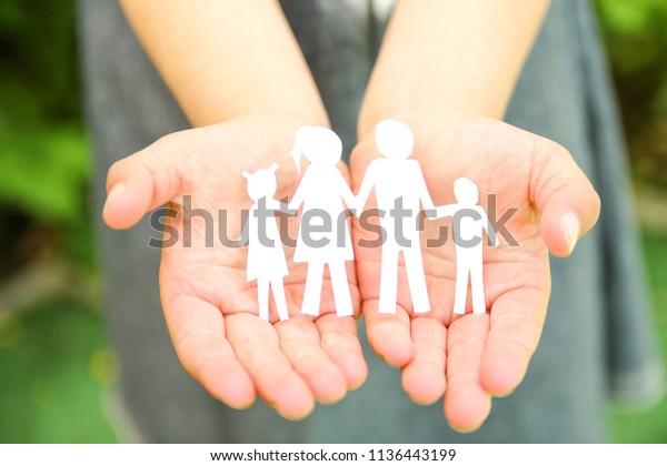 in the
hands of the family on a background
paper