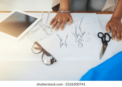 Hands, fashion designer and sketch with paperwork at workshop for review process, style and inspiration. Person, document and drawing with creativity for garment, clothes and tablet at small business - Powered by Shutterstock