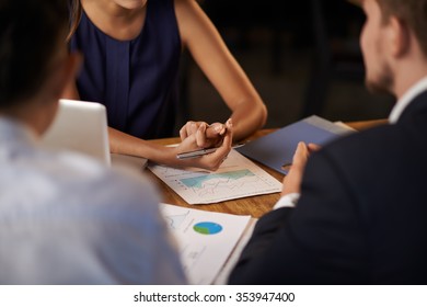 Hands Of Female Entrepreneur Explaining Business Objectives To Her Employees