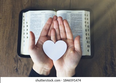 Hands Female Prayer To Load With Broken Heart In Hands On The Bible,Concept Pray For Liberation,sin,no Freedom.