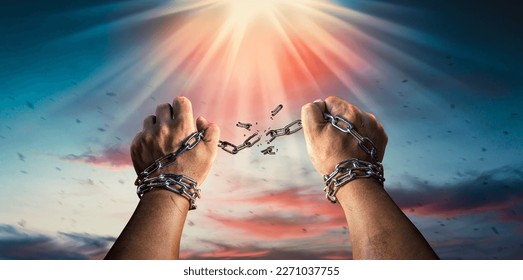 Hands in fists breaking a chain freedom. The concept of gaining freedom.