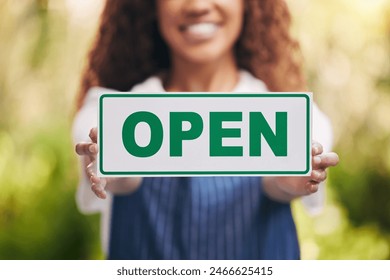 Hands, florist and open sign with smile in garden for promotion, service and welcome to store. Woman, entrepreneur and happy at small business with signage board at eco friendly nursery for plants - Powered by Shutterstock