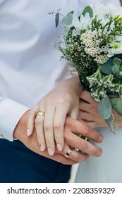 Hands with flowers, wildflowers and rings. Wedding - Shutterstock ID 2208359329