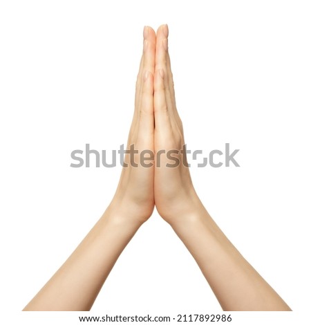 Hands folded in namaste prayer isolated on white. Female hands pray show hope and religion. Indian or yoga gesture fingers.