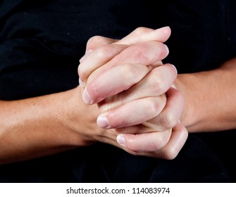 Hands folded as if in prayer or showing closeness and connection as in teamwork