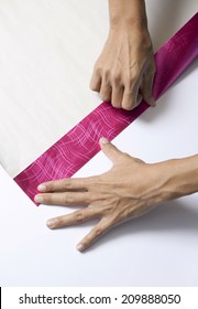 Hands Folding Paper For Wrapping Present