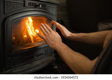 Hands In Front Of The Fire To Keep Warm