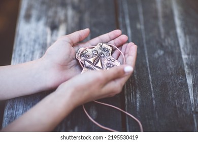 Hands Of Girl Holding Crucifix For Holy Confirmation Or Communion.