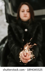 Hands Of A Girl With A Sparkler Close-up