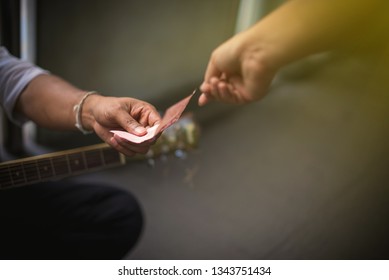 Hands giving money and Hand holding receipt money - Image