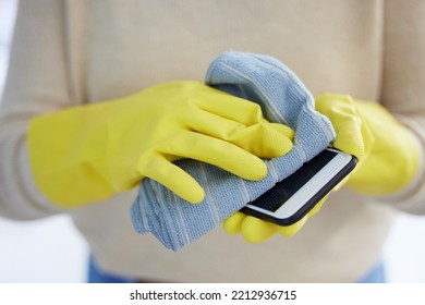 Hands, Gloves And Cleaning Phone Screen Of Germs, Bacteria With Alcohol Wipe Or Dust Cloth. Covid, Disinfection And Safety, Clean Smartphone In Home Or Office For Protection From Virus Infection.