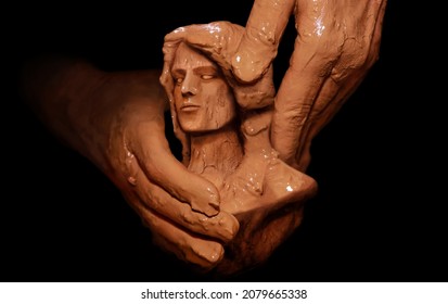 Hands Of God Creating Man From Clay. Biblical Concept Religion Theme.