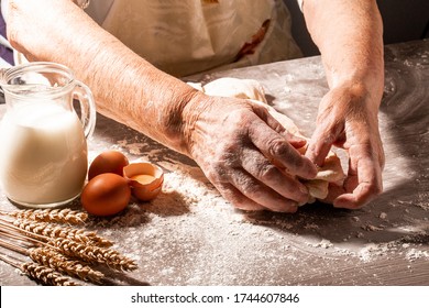 Hands Of Granny Kneads Dough. 80 Years Old Woman Hands Kneading Dough. Homemade Baking. Pastry And Cookery.