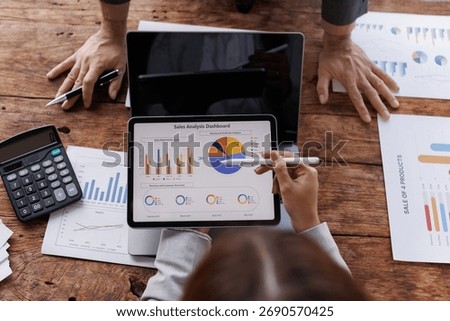 Hands and graphs on tablet screen for finance results, profit growth and budget review. Staff, team and digital with financial report, revenue stats and dividend comparison of risk assessment
