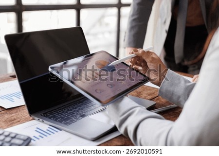 Hands and graphs on tablet screen for finance results, profit growth and budget review. Staff, team and digital with financial report, revenue stats and dividend comparison of risk assessment
