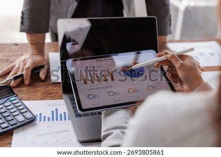 Hands and graphs on tablet screen for finance results, profit growth and budget review. Staff, team and digital with financial report, revenue stats and dividend comparison of risk assessment
