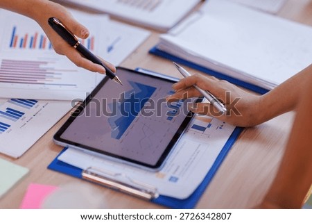 Hands and graphs on tablet screen for finance results, profit growth and budget review. Staff, team and digital with financial report, revenue stats and dividend comparison of risk assessment