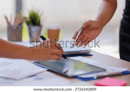 Hands and graphs on tablet screen for finance results, profit growth and budget review. Staff, team and digital with financial report, revenue stats and dividend comparison of risk assessment