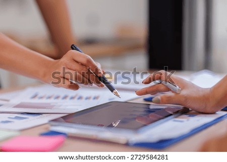 Hands and graphs on tablet screen for finance results, profit growth and budget review. Staff, team and digital with financial report, revenue stats and dividend comparison of risk assessment