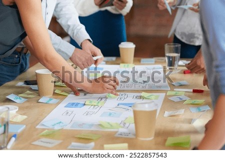 Hands, group and documents in office with sticky note, planning and mindmap for inspiration at company. People, huddle and scrum for brainstorming, teamwork or synergy for solution at creative agency
