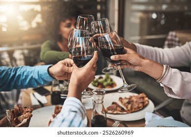 Hands, group and friends cheers with red wine for new year party, celebration or event closeup. Alcohol, glasses and people toast together at social gathering with pizza, food or dinner at restaurant - Powered by Shutterstock