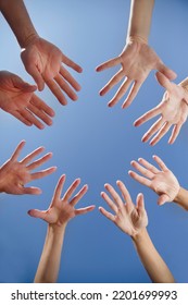 Hands  Group  People Who Stay Together In A Circle Against The Background Of The Blue Sky