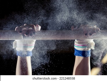 hands of gymnast with chalk on uneven bars  - Powered by Shutterstock