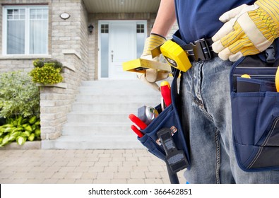 Hands of Handyman with a tool belt. 