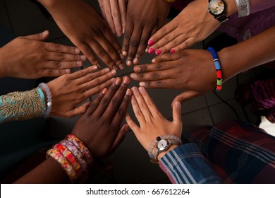 Hands of happy group of African people which stay together in circle happy