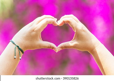 Hands As A Hart Shape With Pink Background