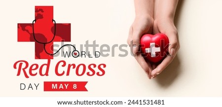 Hands with heart on light background, top view. Banner for World Red Cross Day
