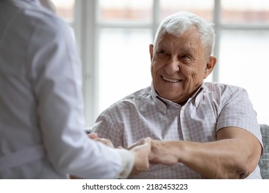 Hands of help. Professional specialist doctor support encourage retired older man patient holding his palms. Hopeful elderly male trust attending physician not feeling alone struggling with diagnosis