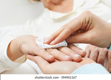 Hands Helping With Personal Hygiene For Senior Woman