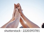 Hands, high five and collaboration on sports goal with friends in trust huddle for motivation, support and energy. Hand, fitness and people in team for exercise, workout and training against blue sky