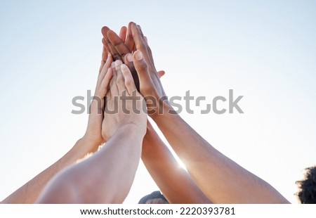 Hands, high five and collaboration on sports goal with friends in trust huddle for motivation, support and energy. Hand, fitness and people in team for exercise, workout and training against blue sky