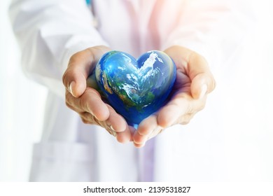 Hands Hold Earth Ball In Heart Shape On Doctor Hands  For World Health Day Content And Copy Space.Elements Of This Image Furnished By NASA