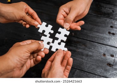 Businessman’s hands hold white jigsaw puzzle piece, symbolizing strategy and problem-solving.importance of teamwork, collaboration, and finding solutions in business challenges and partnerships.