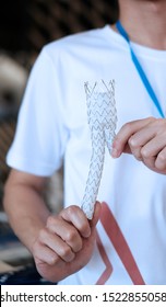 Hands Holding Aortic Stent Graft For Endovascular Aneurysm Repair (evar) Procedure