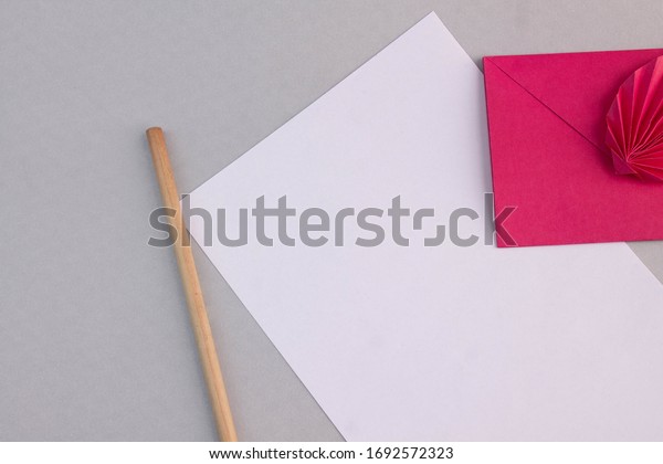 Hands holding black card\
envelope