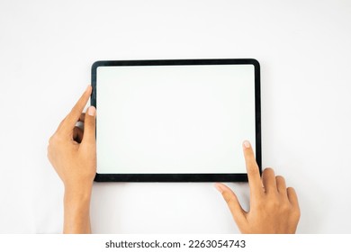 hands holding blank screen tablet for mockups - Powered by Shutterstock