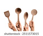 Hands Holding Brown Kitchen Utensils Isolated on White Background