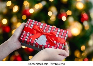 hands holding christmas gift box. christmas decor