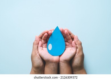 Hands holding clean water drop,world water day,hand sanitizer and hygiene, vaccine for covid-19 pandemic, family washing hands, CSR, save water, clean renewable energy, flood disaster relief concept - Shutterstock ID 2126309372