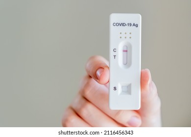 Hands Holding Covid-19 Rapid Antigen Test Cassette With Negative Result Of Rapid Diagnostic Test At Home